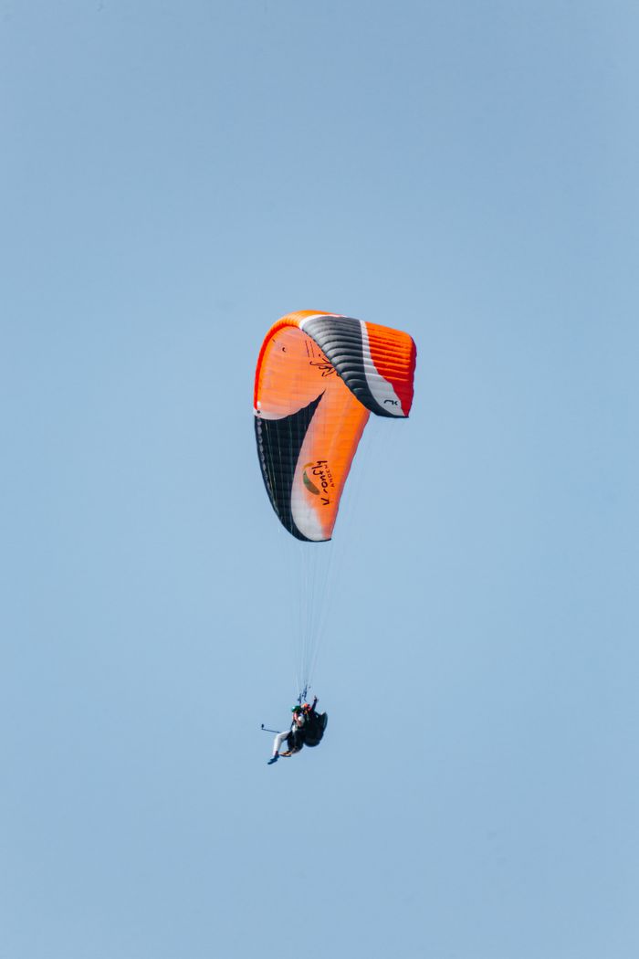 Enjoying tandem paragliding in the clear sky over Alanya, Türkiye.